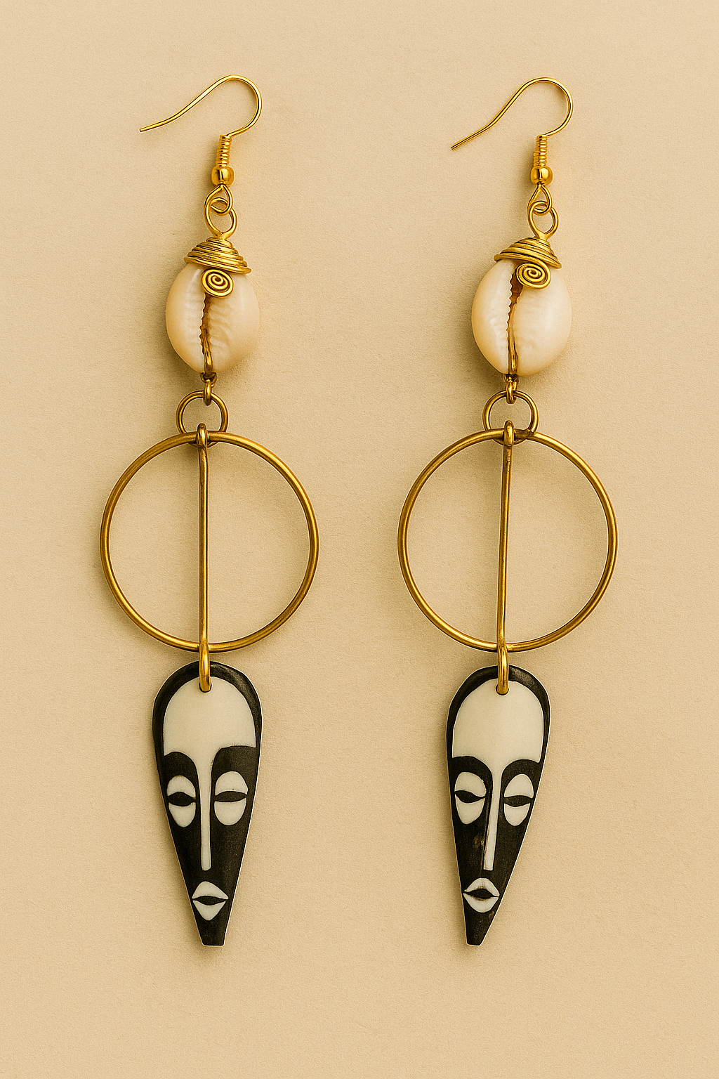 Brass cowrie bone mask earring